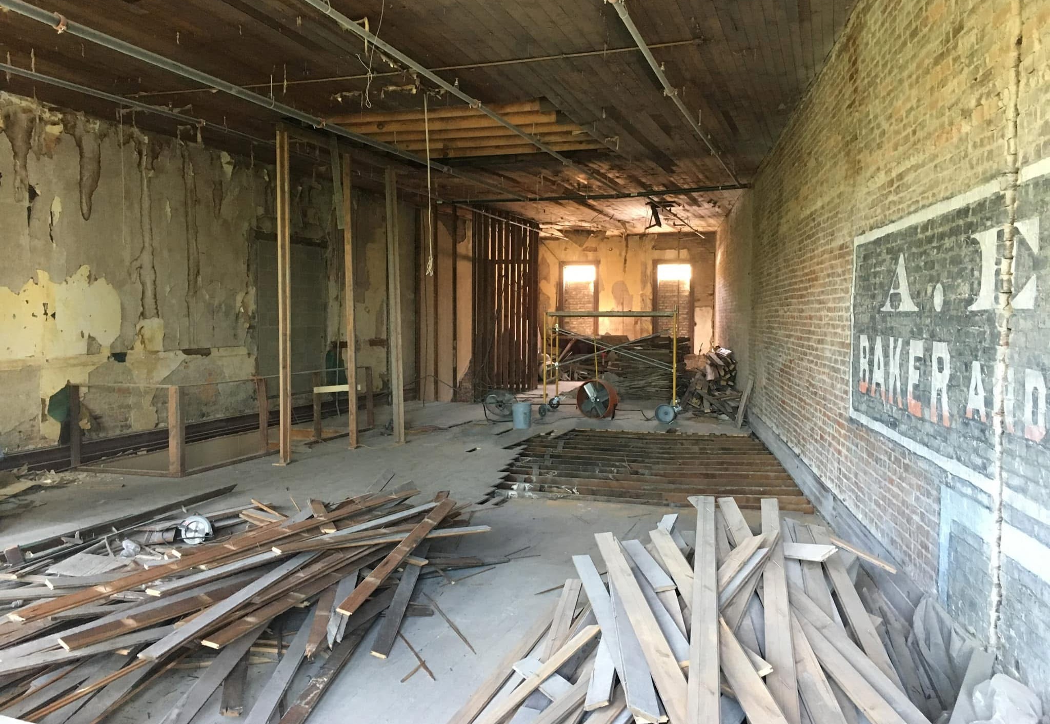 Capone’s Loft before restoration, with exposed framing and an unfinished interior