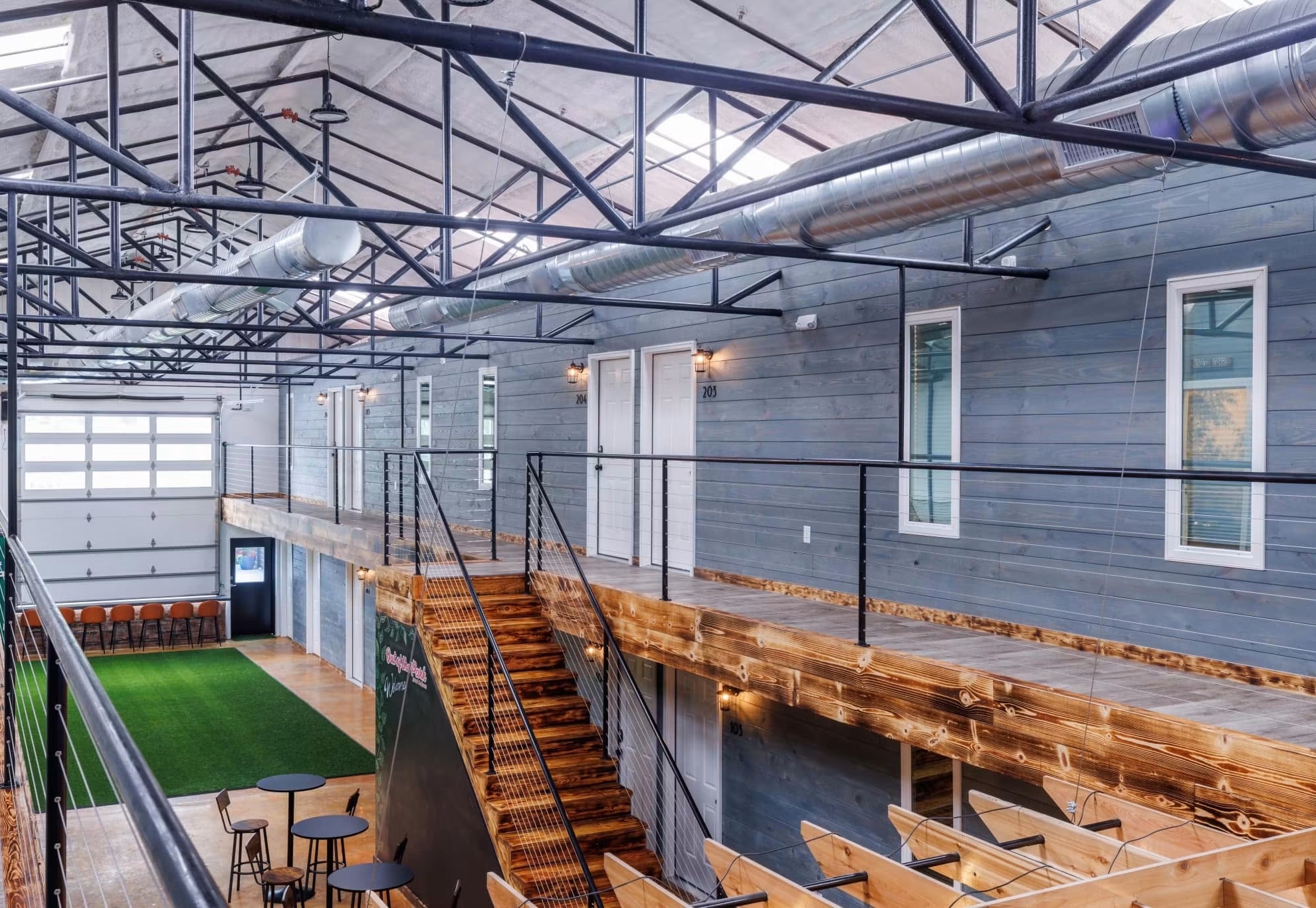 Out Of The Park after adaptive reuse, with a finished upper walkway and recreation space